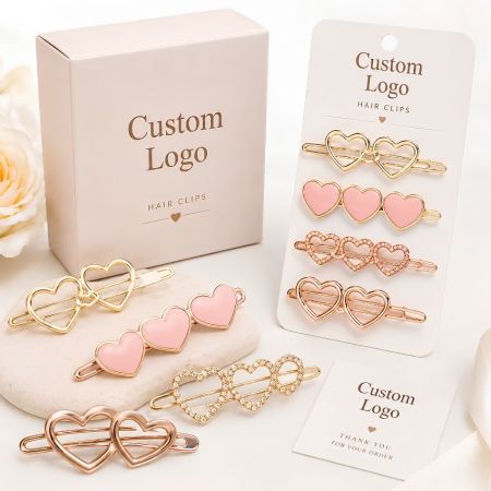 Custom logo pink enamel and rhinestone heart-shaped metal hair clips set with matching wholesale display cards.