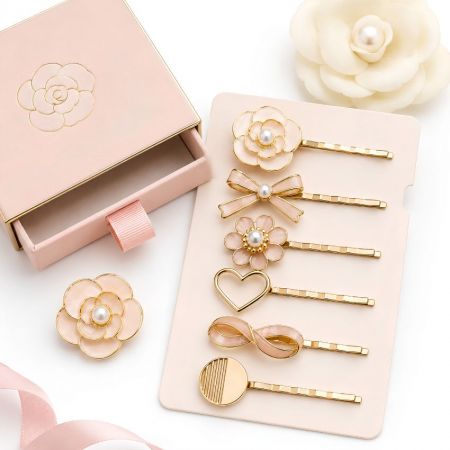Premium pearl and pink camellia flower enamel hair pins wholesale with elegant slide-out gift box for luxury brands.