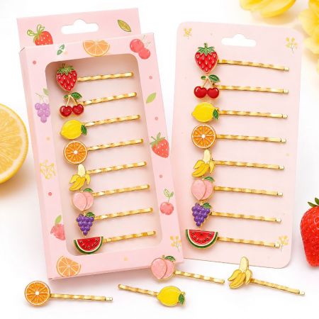 Custom fruit enamel hair clips wholesale featuring strawberry, lemon, and watermelon charms on retail backing cards.