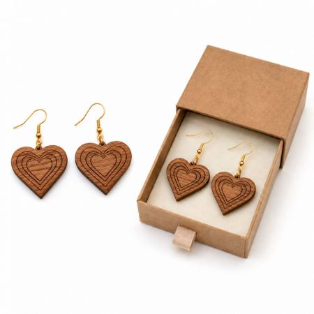 Heart-shaped engraved wood dangle earrings with minimalist cardboard gift box for eco-conscious jewelry brands.