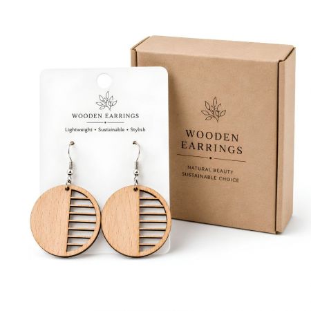 Minimalist half-slat round wood earrings, displayed on a product card next to sustainable gift packaging.