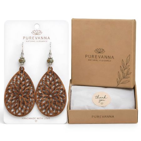 Laser-cut filigree teardrop wood earrings with beads, displayed with a branded kraft jewelry box and tissue wrap.