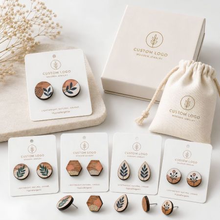 Hand-painted botanical wooden stud earrings in round, hexagon, and teardrop shapes with modern floral motifs.