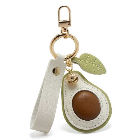 Close-up of the cute PU leather avocado keychain showing the detailed design and gold clasp.