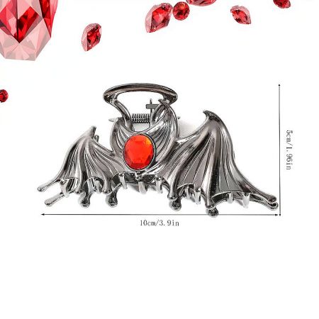 Angled view of the bat-shaped hair clip highlighting its metallic texture.