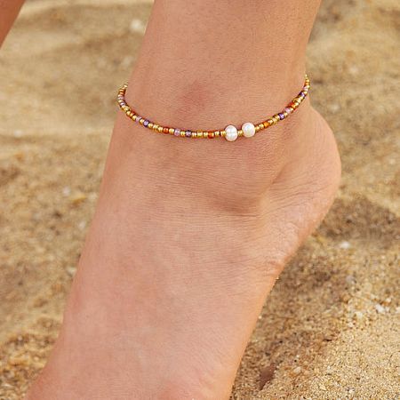 Stainless steel beach jewelry anklet with pearls and colorful stained glass beads, perfect for summer styles.