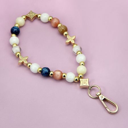 Multicolor acrylic beaded phone charm that can also be used as a keychain.