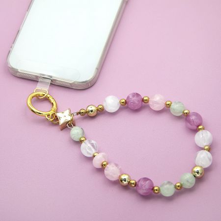 Beaded phone strap attached to a smartphone, demonstrating its use as a wristlet.