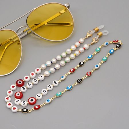 Evil Eye Glass Chains Eyewear Strap Mask Chain Lanyard - A stylish gold-plated Evil Eye beaded chain shown attached to a pair of sunglasses, serving as a fashionable eyewear strap.