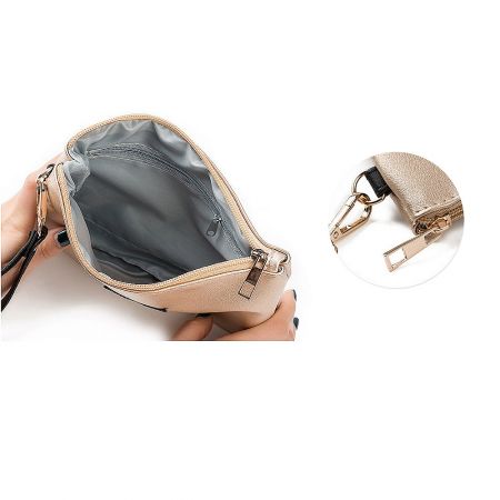 Interior view of the sparkly star clutch bag showing the gray lining and gold zipper detail.