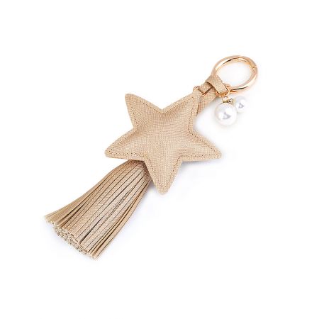 Close-up of the beige star-shaped PU leather keychain with a matching tassel and elegant pearl charm.