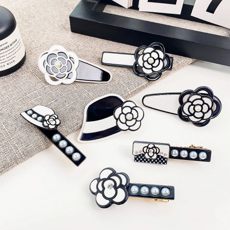 Fashion Camellia Black Acrylic Pearl Hair Clips (Set of 5) - A collection of stylish black and white acrylic hair clips featuring various camellia flower and pearl designs, displayed on a neutral background.