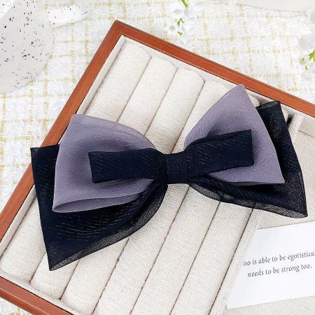Elegant black and gray double-color ribbon bow hair clip.