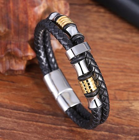 Close-up view of the genuine leather men's bracelet with detailed gold and steel accents.