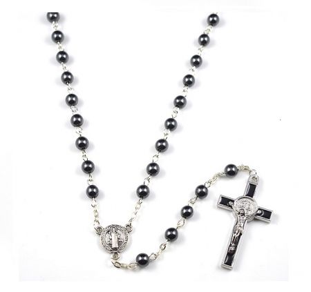 Close-up of the black rosary beads and silver chain.