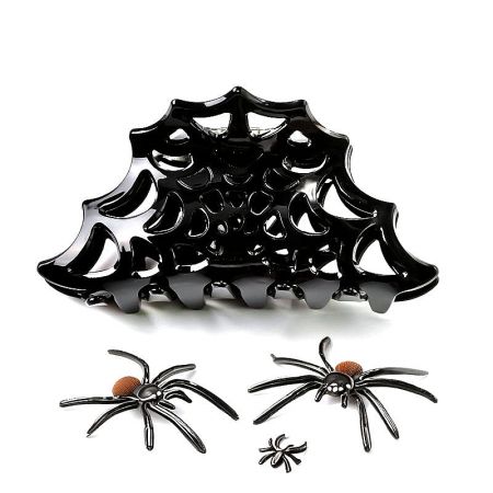 Detailed view of the black spider web hair clip with matching accessories.