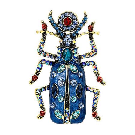 Detailed close-up of the blue vintage beetle brooch, showcasing its vibrant gemstones and antique finish.