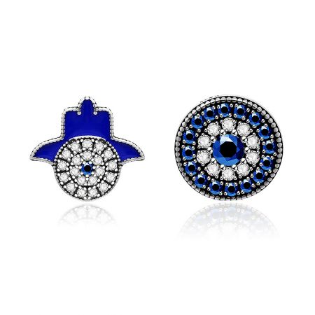 A pair of Fatima Hand and circular blue gemstone stud earrings displayed together.