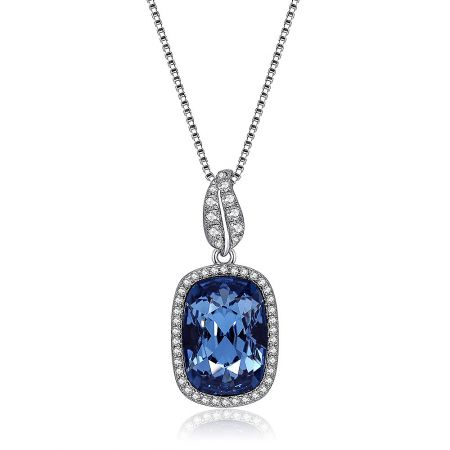 Close-up view of the blue Swarovski crystal pendant on the sterling silver necklace.