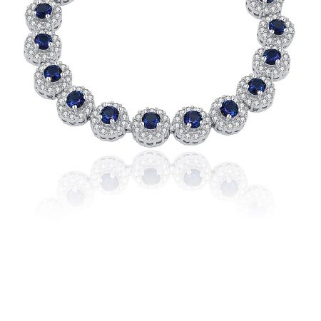 Close-up detail of the Sapphire Elegance Bracelet showing the intricate bezel setting of the blue and clear cubic zirconia stones.