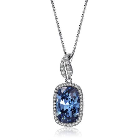 Detailed shot of the rhodium-plated sterling silver necklace with a rectangular blue Swarovski crystal.