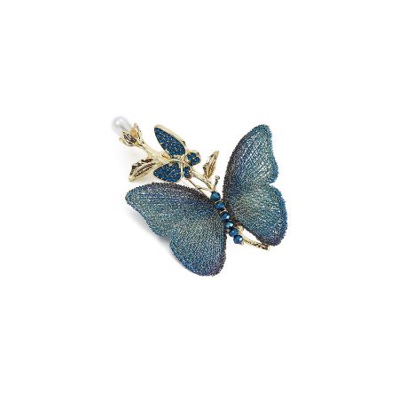 The blue butterfly brooch displayed as a versatile jewelry piece, highlighting its fine craftsmanship.