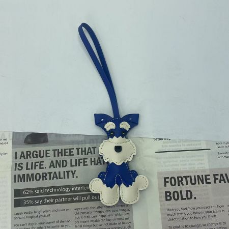 Detailed view of the blue and white PU leather Schnauzer keychain.