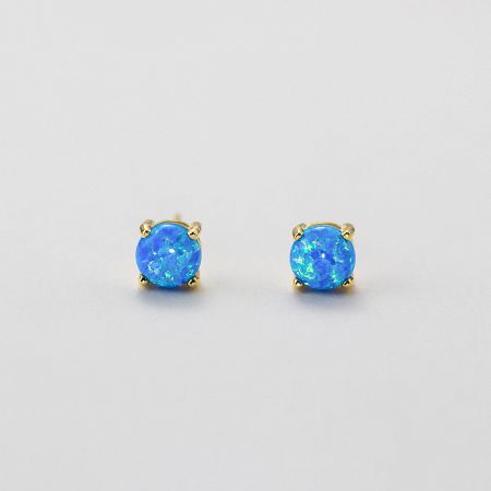 A pair of stunning ocean blue opal earrings set in a polished gold finish.
