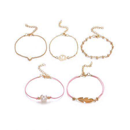 A collection of gold and pink cord charm bracelets arranged for display.