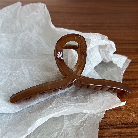 Brown acetate hair jaw clip with French design.