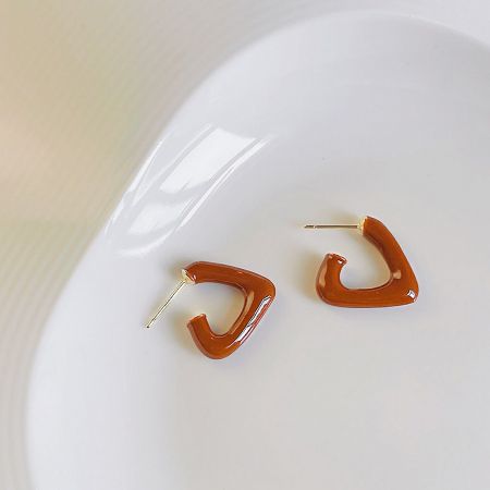 Alternative color view of the enamel stud earrings, showing style versatility.