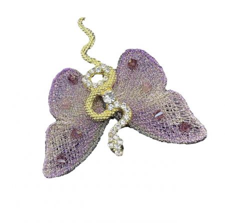 Angled view of the purple butterfly brooch, highlighting its potential use as a pendant.