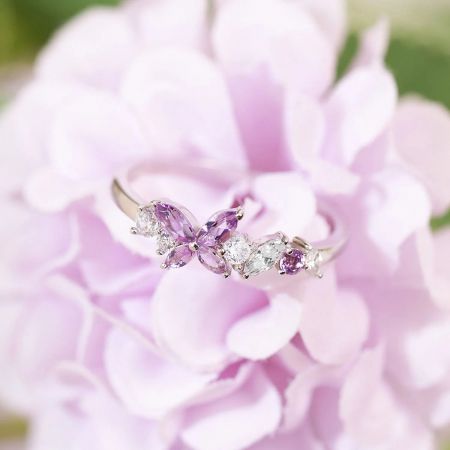 Detailed view of the Amethyst Butterfly Ring highlighting the gemstone setting and silver band.