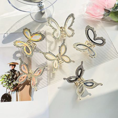 A set of butterfly hair clips showcasing different rhinestone embellishments and color options.