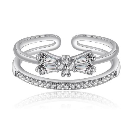 Glamorous Bow Ring - A close-up of the Glamorous Bow Ring, featuring a delicate bow design crafted from rhodium-plated brass and intricately set with sparkling cubic zirconia stones.