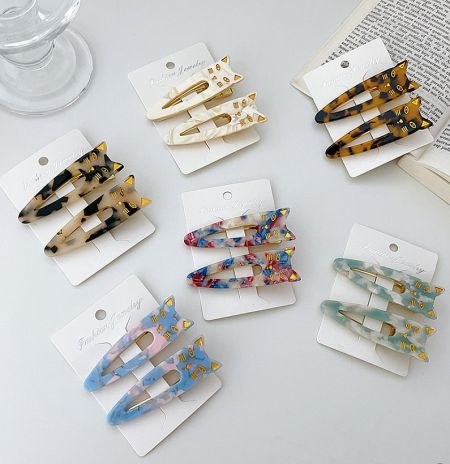 Wholesale Minimalist Cat Hair Clip - A collection of colorful minimalist cat-shaped hair clips, available for wholesale from JR Fashion Accessories.