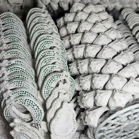 Ceramic molds used for investment casting in jewelry manufacturing.