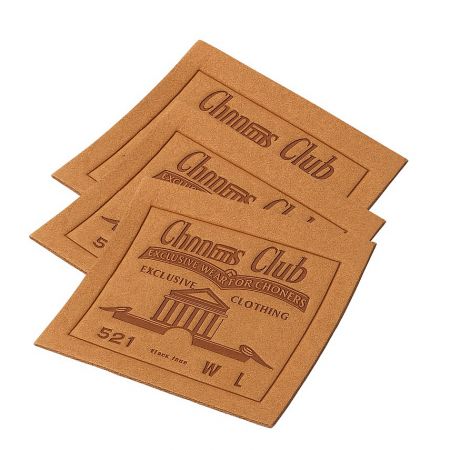 Branded 'Chon's Club' leather clothing tags for exclusive member apparel.