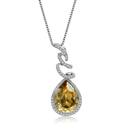 Detailed view of the citrine teardrop pendant with surrounding crystals.