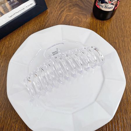 The minimalist transparent hair claw clip, suitable for any outfit.