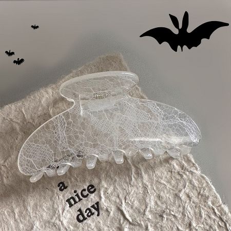 Close-up of the clear lace pattern hair claw clip.