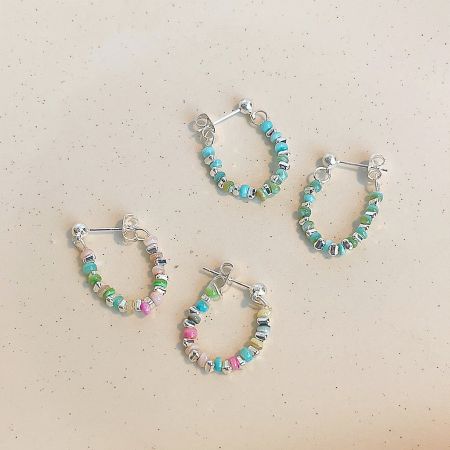 Silver Plated Multi-Color Beaded Dangle Earrings (5 Pairs) - A set of three pairs of silver-plated hoop earrings adorned with vibrant, multi-colored beads, displayed on a clean white background.