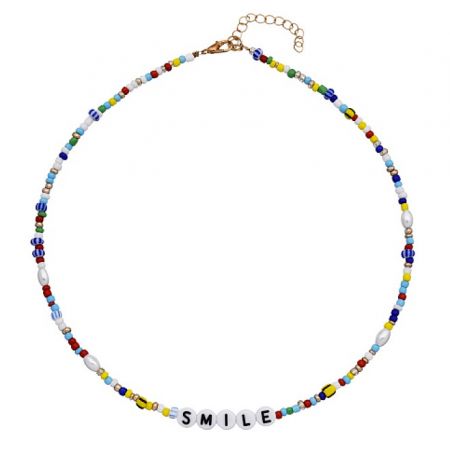Detailed view of the vibrant, multi-colored beads and 'SMILE' letter accents on the handmade necklace.