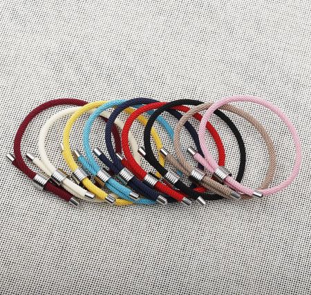 A collection of colorful rope bracelets including blue, black, and brown, showcasing the available options.