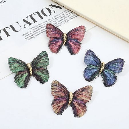 Brooch and Pins Collection - A vibrant collection of four colorful butterfly brooches from JR Fashion Accessories, showcasing intricate fabric and metallic details.