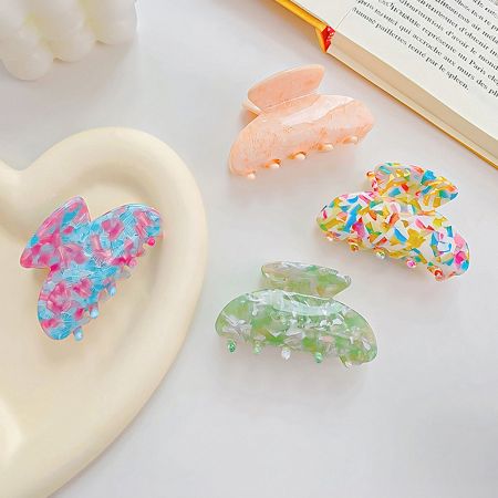 A beautiful collection of colorful butterfly-shaped hair clips.