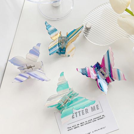 An assortment of colorful butterfly hair clips displayed together.