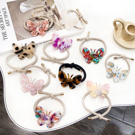 Woman Butterfly Acetate Elastic Hairband & Ponytail Holders (Set of 5) - A vibrant collection of butterfly-shaped acetate hair ties in various marbled colors, perfect for ponytails and stylish updos.