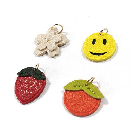 Creative PU Leather Keychain – Smiley Face, Strawberry, Orange, Flower Charms - A collection of four creative PU leather charms including a white flower, yellow smiley face, red strawberry, and an orange, from JR Fashion Accessories.