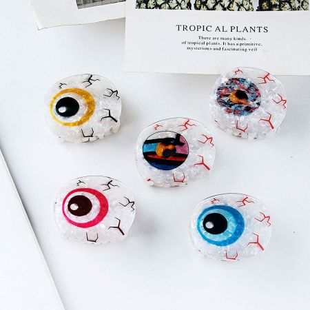 Multiple Evil Eye hair clips in a variety of vibrant colors.